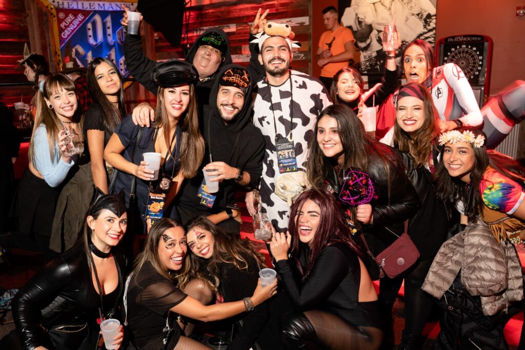 People in costumes outside local pubs (Halloween)