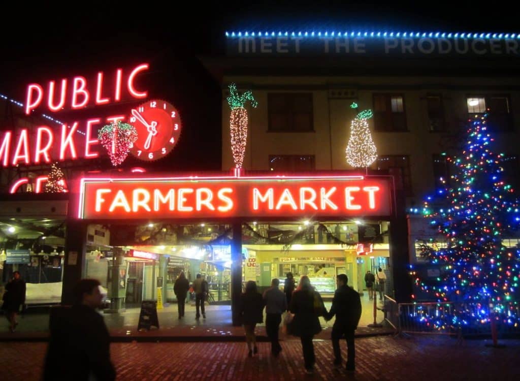 Pike Place Market with Christmas lights and holiday shoppers 2025