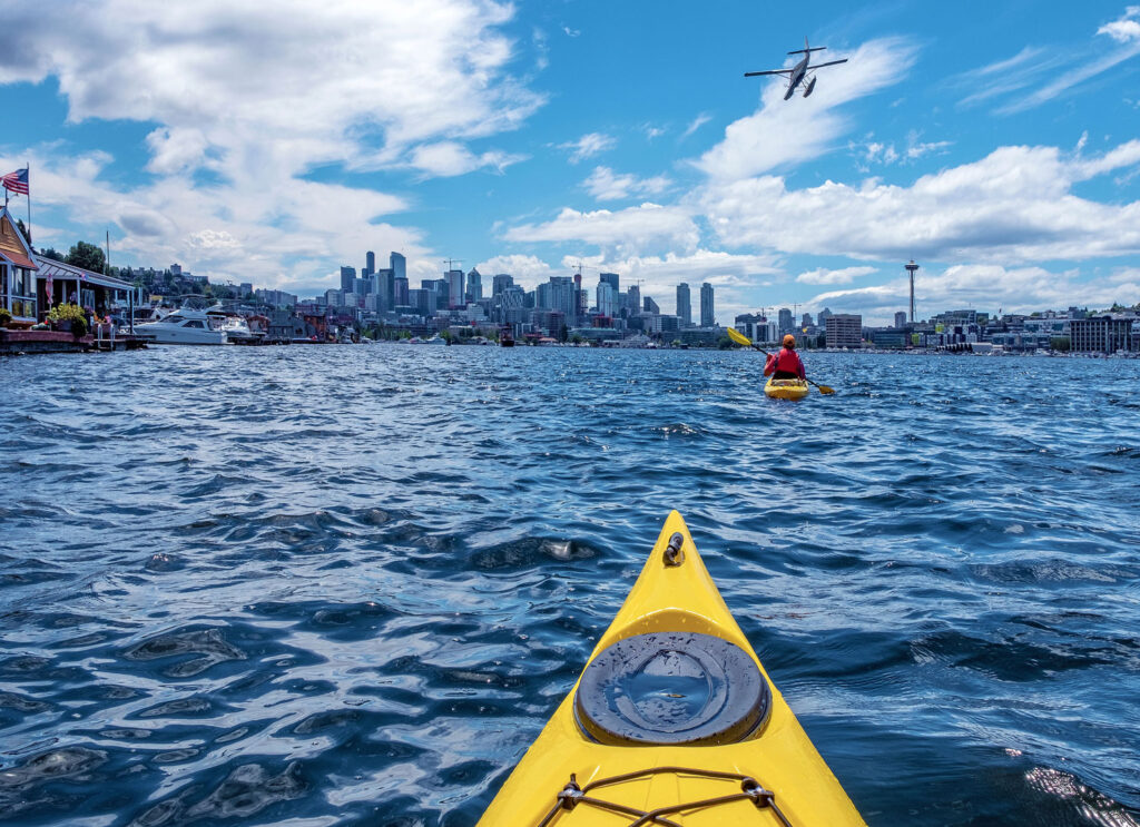 Kayakers enjoying sunny weather on Lake Union during Seattle Labor Day 2025.