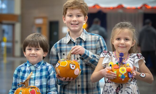 Children painting pumpkins at Oktoberfest Seattle 2025